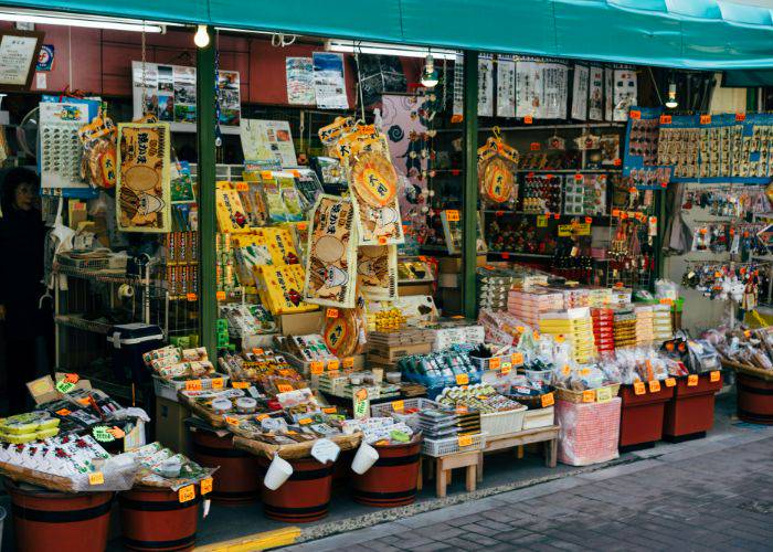 The exterior of a Kyoto souvenir shop, showing off all kinds of wares for sale.